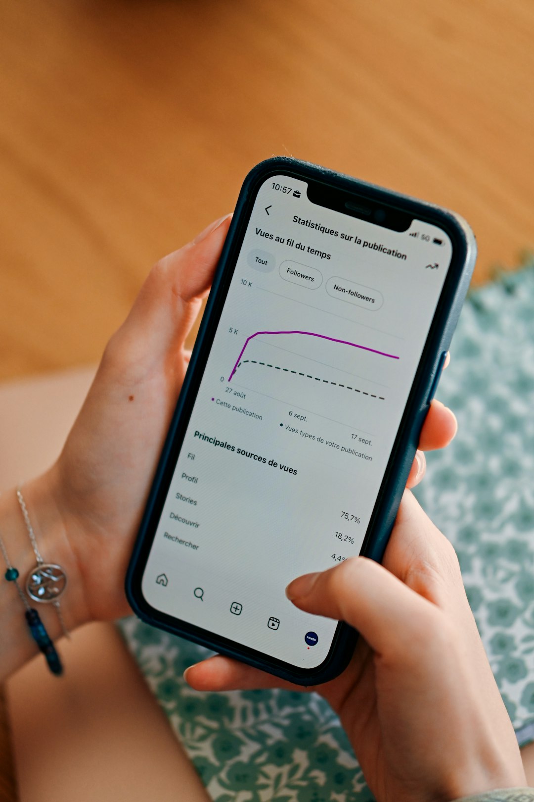 person-using-smartphone-to-view-social-media-analytics-4lkfi3kqnd8